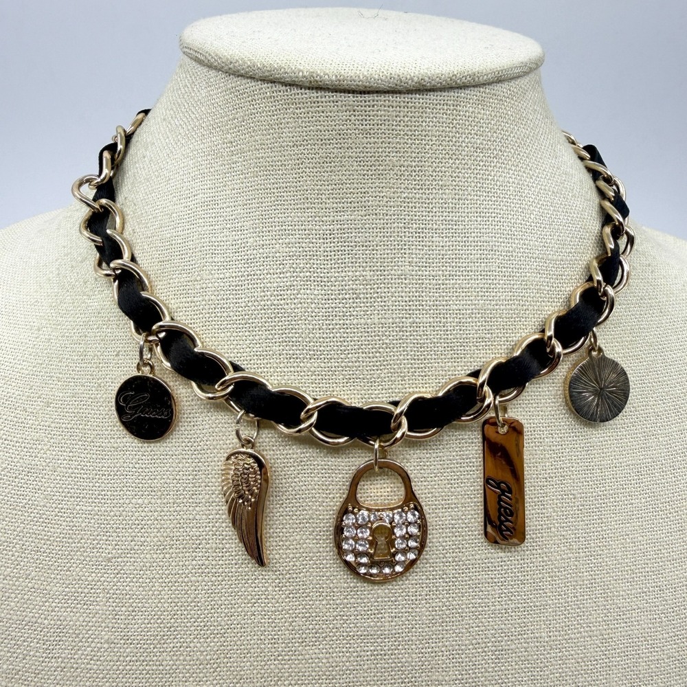 GUESS Gold Tone Black Ribbon Charm Necklace Rhinestone Padlock Angel Wing Logo